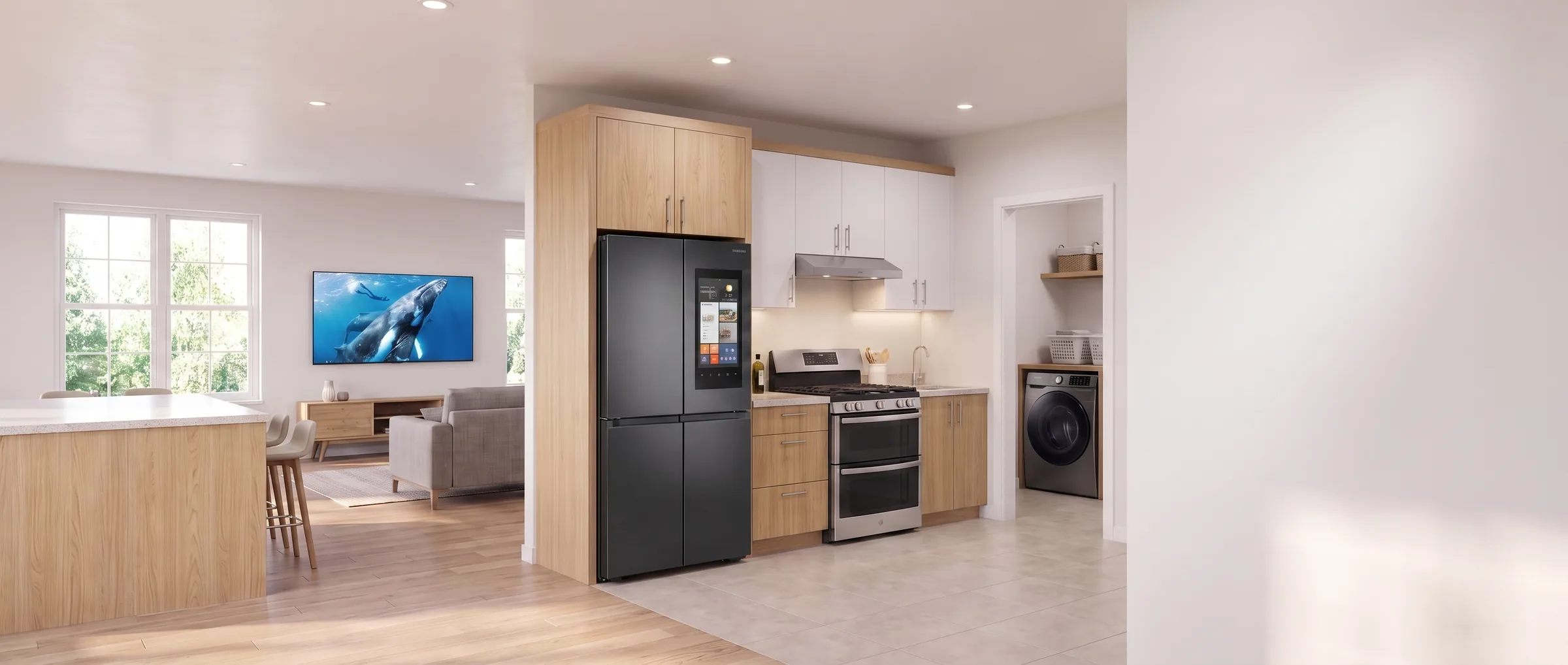 An open-plan home fully outfitted with ACH appliances - refrigerator, range, washer and a large television